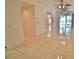 Open living area with tile floors and access to patio at 4264 Central Sarasota Pkwy # 116, Sarasota, FL 34238