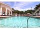 Inviting community pool with clear water and lounge chairs at 4264 Central Sarasota Pkwy # 116, Sarasota, FL 34238