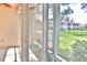 Sunroom with sliding glass doors showcasing a tranquil outdoor view at 4264 Central Sarasota Pkwy # 116, Sarasota, FL 34238