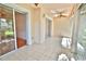 Bright sunroom with sliding doors leading to the outdoors at 4264 Central Sarasota Pkwy # 116, Sarasota, FL 34238