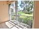 Sunroom with sliding glass doors and a view of the backyard and trees at 4264 Central Sarasota Pkwy # 116, Sarasota, FL 34238