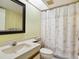 Clean bathroom with shower and seashell decor at 5228 Landings Blvd # 202, Sarasota, FL 34231