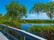 Peaceful boardwalk path overlooking a tranquil waterway at 5228 Landings Blvd # 202, Sarasota, FL 34231