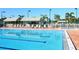 Refreshing community pool with plenty of lounge chairs at 5228 Landings Blvd # 202, Sarasota, FL 34231