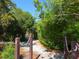 Scenic nature trail with lush foliage and wooden posts at 5228 Landings Blvd # 202, Sarasota, FL 34231