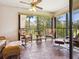 Relaxing sunroom with wicker furniture and scenic views at 5228 Landings Blvd # 202, Sarasota, FL 34231