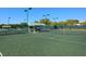 Well-maintained tennis courts with shaded seating at 5228 Landings Blvd # 202, Sarasota, FL 34231