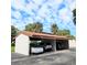 Covered carport providing parking for several cars at 3500 El Conquistador Pkwy # 142, Bradenton, FL 34210