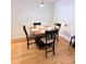 Small dining area with square table and four chairs at 3500 El Conquistador Pkwy # 142, Bradenton, FL 34210