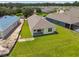 Aerial view of a new single-Gathering home with surrounding houses and landscape at 5323 Cappleman Loop, Brooksville, FL 34601