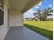 Covered patio with a view of the backyard and neighboring homes at 5323 Cappleman Loop, Brooksville, FL 34601