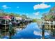 Scenic boat dock featuring several boats parked along the wooden piers reflecting in the water at 5654 Simonton St, Bradenton, FL 34203