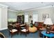Cozy clubhouse lounge area featuring a comfortable leather sofa and bookshelves with nautical-themed decor at 5654 Simonton St, Bradenton, FL 34203