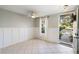 Inviting entryway featuring tile flooring, white wainscoting, and lots of natural light at 5654 Simonton St, Bradenton, FL 34203