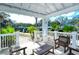 Relaxing gazebo interior with wooden furniture overlooking the boat dock at 5654 Simonton St, Bradenton, FL 34203