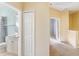 Hallway leading to the bedroom and bathroom with linen closet at 5654 Simonton St, Bradenton, FL 34203
