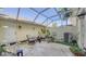 Enclosed patio with lounge seating and potted plants, perfect for outdoor enjoyment at 5654 Simonton St, Bradenton, FL 34203