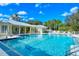 Beautiful community pool surrounded by lush landscaping at 5654 Simonton St, Bradenton, FL 34203