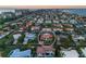 Aerial view of a waterfront home with a circular driveway at 531 Ranger Ln, Longboat Key, FL 34228