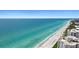 Coastal aerial view showing beach, ocean, and buildings at 531 Ranger Ln, Longboat Key, FL 34228