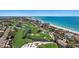 Aerial view showing beachfront property and golf course at 531 Ranger Ln, Longboat Key, FL 34228