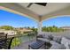 Covered balcony overlooking canal with seating and sofa at 531 Ranger Ln, Longboat Key, FL 34228