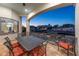 Covered patio with dining table and chairs overlooking the canal at 531 Ranger Ln, Longboat Key, FL 34228