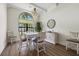 Bright dining room with a white table, chandelier, and hardwood floors at 531 Ranger Ln, Longboat Key, FL 34228