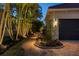 Landscaped walkway and driveway with lighting at 531 Ranger Ln, Longboat Key, FL 34228