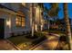 Brick walkway leading to the entrance of a home at night at 531 Ranger Ln, Longboat Key, FL 34228