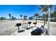 Beach BBQ area with grills and seating at 2383 Harbour Oaks Dr, Longboat Key, FL 34228