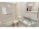 Updated bathroom with granite vanity and a shower/tub combo at 2383 Harbour Oaks Dr, Longboat Key, FL 34228