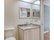 Bathroom with granite vanity and updated fixtures at 2383 Harbour Oaks Dr, Longboat Key, FL 34228