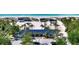 Beach club with blue roof and palm trees at 2383 Harbour Oaks Dr, Longboat Key, FL 34228
