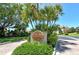 Welcoming entrance to Harbour Circle community with lush landscaping at 2383 Harbour Oaks Dr, Longboat Key, FL 34228