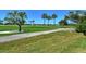 Scenic view of a beautifully landscaped golf course at 2383 Harbour Oaks Dr, Longboat Key, FL 34228