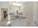Well-equipped kitchen with white cabinets, granite island, and stainless steel appliances at 2383 Harbour Oaks Dr, Longboat Key, FL 34228