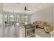 Open concept kitchen and living area with granite island, stainless steel appliances, and golf course views at 2383 Harbour Oaks Dr, Longboat Key, FL 34228