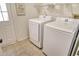 Laundry room with washer, dryer, and extra shelving at 2383 Harbour Oaks Dr, Longboat Key, FL 34228