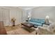 Living room with hardwood floors, comfortable seating, and a view of dining area at 2383 Harbour Oaks Dr, Longboat Key, FL 34228