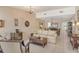 Open concept living room with a comfortable sofa and neutral color palette at 2383 Harbour Oaks Dr, Longboat Key, FL 34228