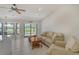 Spacious living room with golf course views and neutral color palette at 2383 Harbour Oaks Dr, Longboat Key, FL 34228
