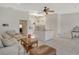 Living room with neutral decor, kitchen island, and plenty of natural light at 2383 Harbour Oaks Dr, Longboat Key, FL 34228