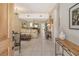 Bright and airy living room with tiled floors, neutral decor and views to dining area at 2383 Harbour Oaks Dr, Longboat Key, FL 34228