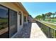 Spacious patio with golf course view and sliding glass doors at 2383 Harbour Oaks Dr, Longboat Key, FL 34228