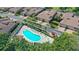 Resort-style pool and spa with lounge chairs; community features at 2383 Harbour Oaks Dr, Longboat Key, FL 34228