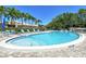 Relaxing kidney-shaped pool with plenty of lounge chairs at 2383 Harbour Oaks Dr, Longboat Key, FL 34228