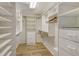 Large walk-in closet with ample shelving and hanging space at 2383 Harbour Oaks Dr, Longboat Key, FL 34228
