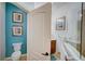 Small bathroom with toilet and blue accent wall at 4826 Maymont Park Cir, Bradenton, FL 34203