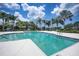 Relaxing community pool surrounded by palm trees at 4826 Maymont Park Cir, Bradenton, FL 34203